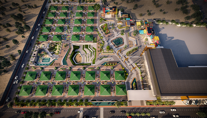 Aerial view of a modern residential area with green rooftops and various amenities.